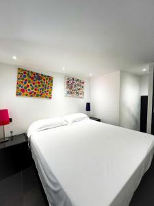 En eller flere senge i et værelse på Old Town Portofino Coast