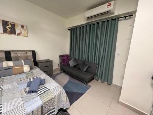 a hotel room with a bed and a chair at Mie Homestay Edusphere Suite, University of Cyberjaya near Tamarind Square in Cyberjaya +26 photos