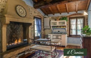 a kitchen with a fireplace and a table and chairs at Il Borghetto Vacanze nei Mulini in Valeggio sul Mincio