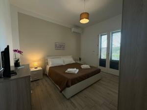 Posteľ alebo postele v izbe v ubytovaní Villa Elemiri
