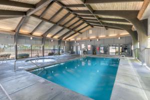 a swimming pool in a large building with a ceiling at Windward Pointe 803 in Orange Beach