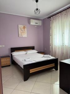 a bedroom with a bed in a room at Vila Ervin Ksamil in Ksamil