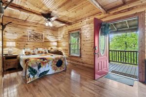 a bedroom with a bed and a door to a balcony at Nature's View Retreat Serenity and Splendor in Hollister
