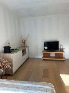 TV a/nebo společenská místnost v ubytování Kamer in hartje van de Vlaamse Ardennen