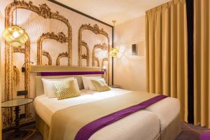 Ένα ή περισσότερα κρεβάτια σε δωμάτιο στο Hotel Yllen Eiffel