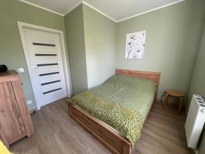 Postel nebo postele na pokoji v ubytování Apartament Okrzejówka