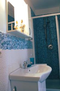 a bathroom with a sink and a shower at I Balconcini Sul Porto in Castellammare di Stabia