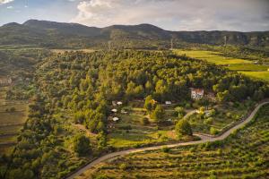 an aerial view of a village in the mountains at La Muntanera - Eco Yurt - Pool, Nature retreat in Figuerola