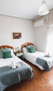 מיטה או מיטות בחדר ב-Casa Rural Dompani, Ahigal