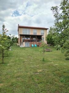 a house on a hill with a yard at Retreat House Herneacova in Herneacova
