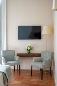 TV a/nebo společenská místnost v ubytování Aqua Mirabilis Relais de Charme