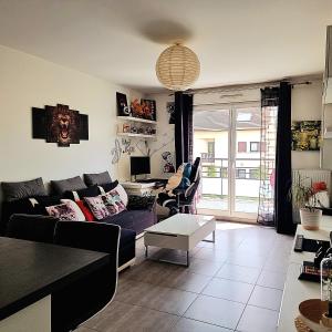 A seating area at Appartement deluxe ac 1 chambre proche Paris Disney 20min rerA ou A4