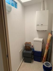 a small bathroom with two trash cans and a sink at Casa sul porto imbarco Tremiti in Termoli