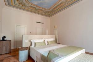 Postel nebo postele na pokoji v ubytování Aqua Mirabilis Relais de Charme