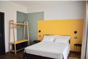 a bedroom with a white bed and a ladder at Domus Solis in Pachino +37 photos