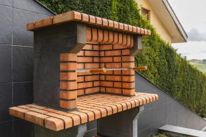a brick oven on the side of a building at Casa Buena Vista in Candás