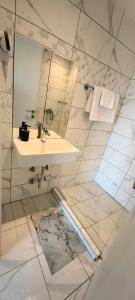a bathroom with a sink and a mirror at TOPAZ three in Siviri +18 photos