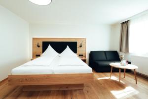 Rúm í herbergi á Hotel Tradizio