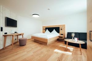 Rúm í herbergi á Hotel Tradizio