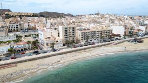 an aerial view of a city with a beach and buildings at Apartamento Boutique Beluga in Garrucha