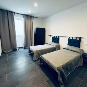 Postel nebo postele na pokoji v ubytování Esterina Rooms
