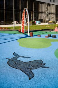 a shark painted on the floor of a playground at Pingvinhotellet UNN Tromsø in Tromsø