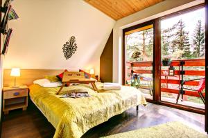 Posteľ alebo postele v izbe v ubytovaní Dolina Resort Zakopane