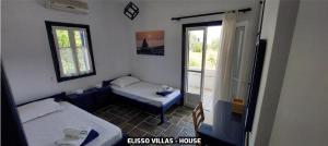 A bed or beds in a room at Elisso Villas