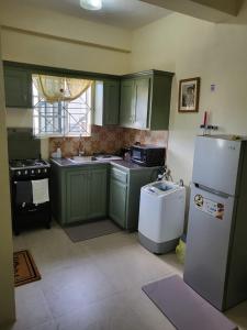 Virtuvė arba virtuvėlė apgyvendinimo įstaigoje Sugar Hill Apartment to rent