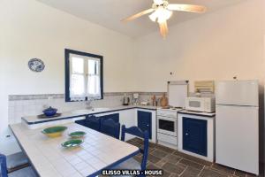 A kitchen or kitchenette at Elisso Villas