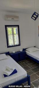 A bed or beds in a room at Elisso Villas