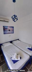 A bed or beds in a room at Elisso Villas