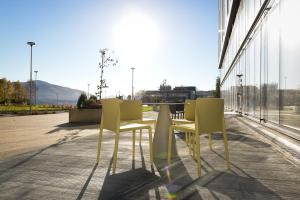 a group of chairs and tables in a building at Pingvinhotellet UNN Tromsø in Tromsø
