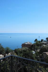 a view of the ocean from a balcony at My Place Your Place in Corniglia