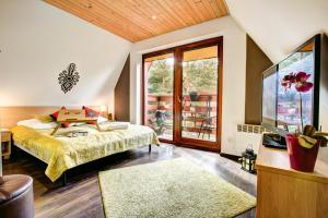 Posteľ alebo postele v izbe v ubytovaní Dolina Resort Zakopane