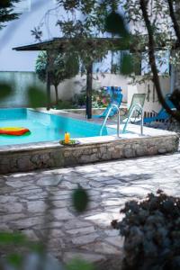 a swimming pool with a toy in the middle at Villa SHU in Krimovice