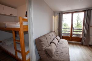 Posteľ alebo postele v izbe v ubytovaní Studio 24m2, 1 chambre pied des pistes
