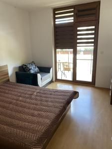 A bed or beds in a room at Blue Summer