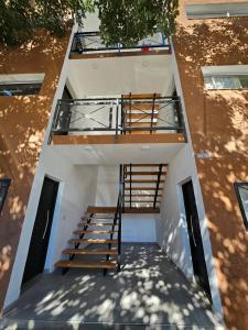 an overhead view of a building with a staircase at Center Cruz del Eje in Cruz del Eje