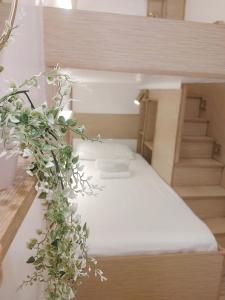 Postel nebo postele na pokoji v ubytování VG Pension and Residences