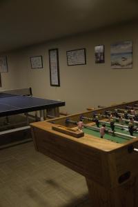a room with a pool table and a ping pong ball at Hotel Gran Azul Bungalows in Canoas De Punta Sal