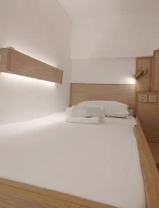 Postel nebo postele na pokoji v ubytování VG Pension and Residences