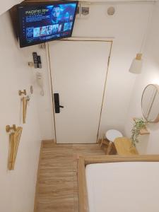TV a/nebo společenská místnost v ubytování VG Pension and Residences