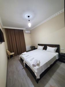 A bed or beds in a room at Hotel N