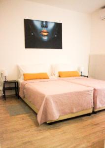 Postel nebo postele na pokoji v ubytování Apartman T&D