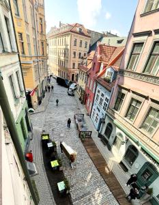 an overhead view of a city street with buildings at Dome square apartment, Old Town in Riga