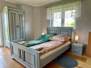 Postel nebo postele na pokoji v ubytování Dom Gościnny Zenit