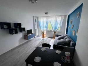 a living room with a couch and a table at Green Tea Apartment Warsaw Centrum in Warsaw +15 photos