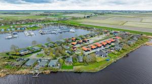 an aerial view of a marina with boats at Lauwershuisje sauna Harbor Lauwersmeer in Anjum
