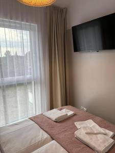 Postel nebo postele na pokoji v ubytování Resort Jantar